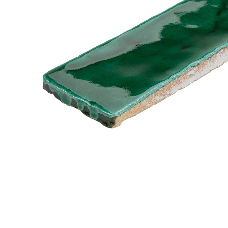 Rectangular glazed tile in bright green; edge shows beige ceramic body; irregular glazed surface with reflections, isolated on white background.