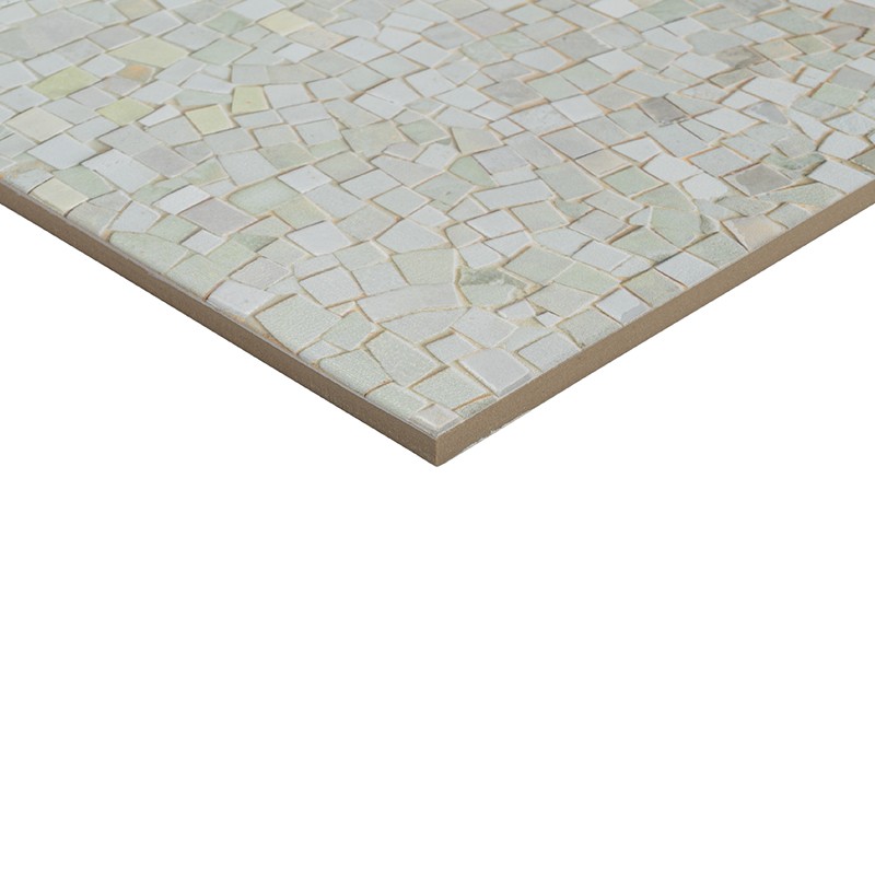 Rectangular tile with mosaic of small iridescent white and beige pieces, visible edge; presented isolated on white background.