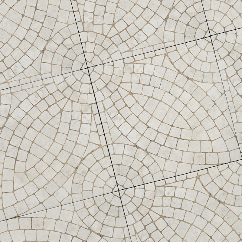Azulejo cerámico con patrón concéntrico de pequeños cuadrados formando arcos; juntas oscuras acentúan el mosaico; colocado en pavimento con piezas moduladas y repetidas.