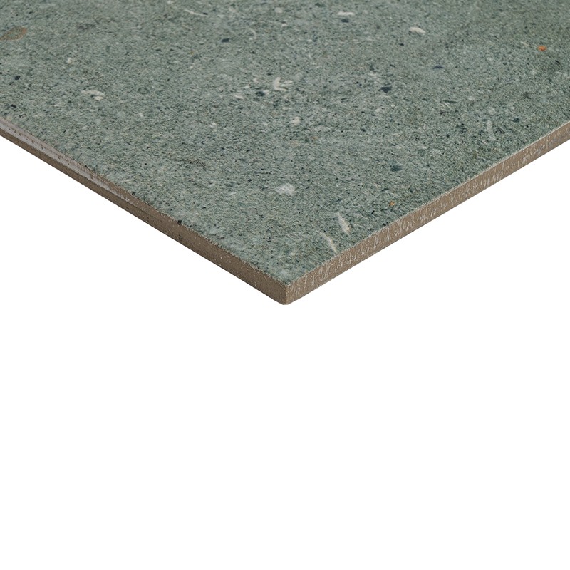 Mottled green tile, visible edge showing thickness and brown core; floats on white background, perspective in lower right corner.