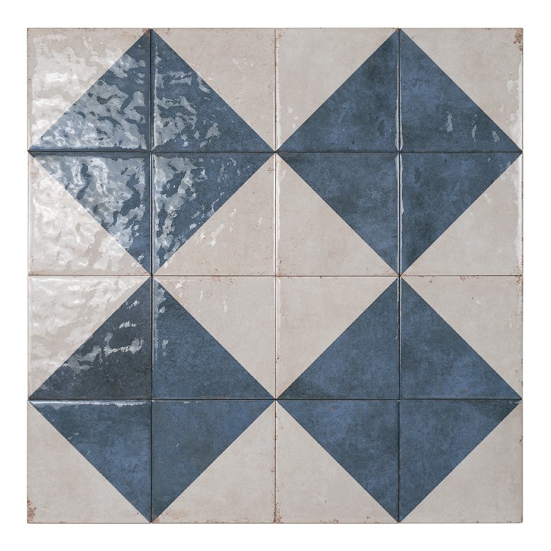 Set of nine square tiles forming a geometric pattern: dark blue and white triangles that create interspersed diamonds; glazed surface with shine, visible joints and wear; cut out on a white background.