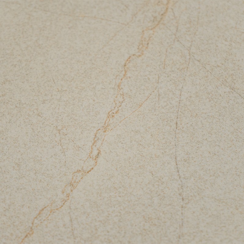 Beige tile with fine orange veins and subtle cracks; textured surface that imitates marble, with no other visible elements.