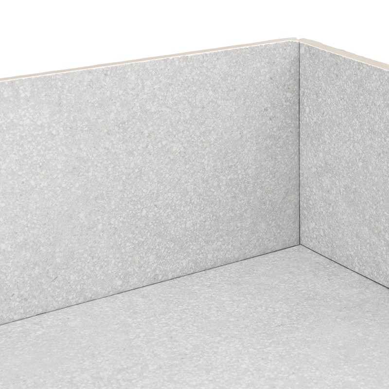 Light gray tile with a speckled texture covering the floor and two interior corner walls, visible joints and a beige top trim; uniform appearance and matte finish.