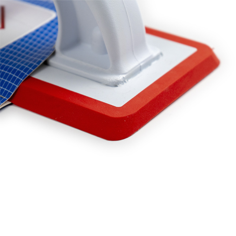 Op een blauwe verpakkingskaart is een rood-witte voegspaan bevestigd. De tekst bevat: `COLOTOOL LLANA DE REJUNTE PRO PRO GROUTIN