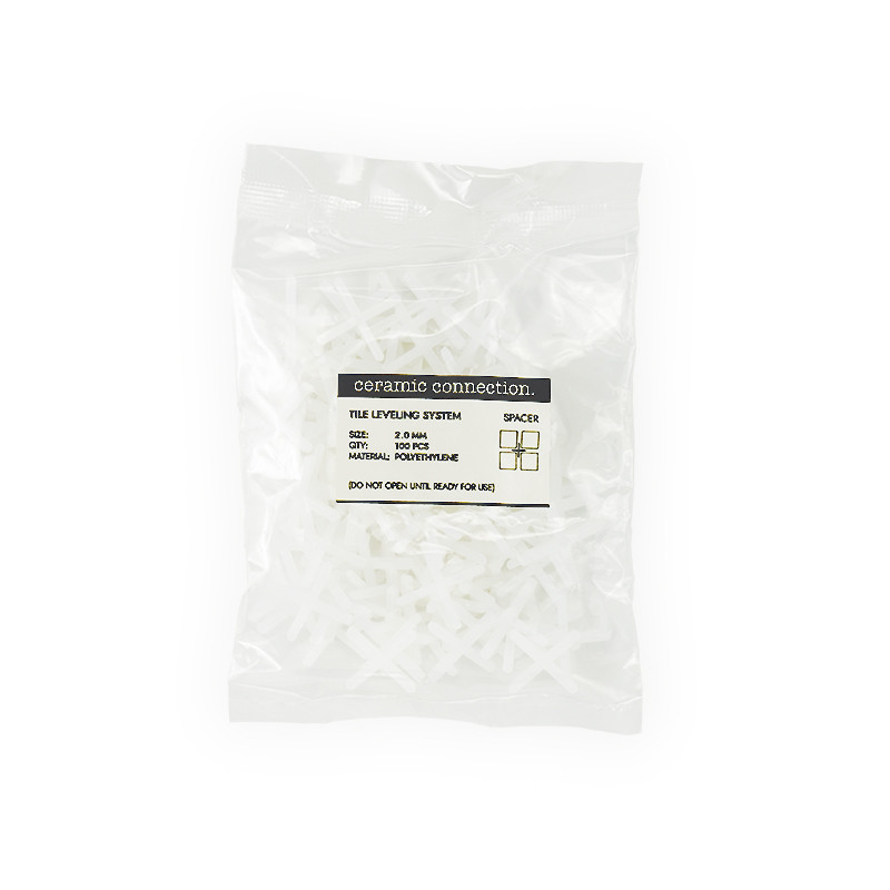 A sealed plastic bag contains white tile leveling spacers. The label reads: `ceramic connection, TILE LEVELING SYSTEM, SPACER, S
