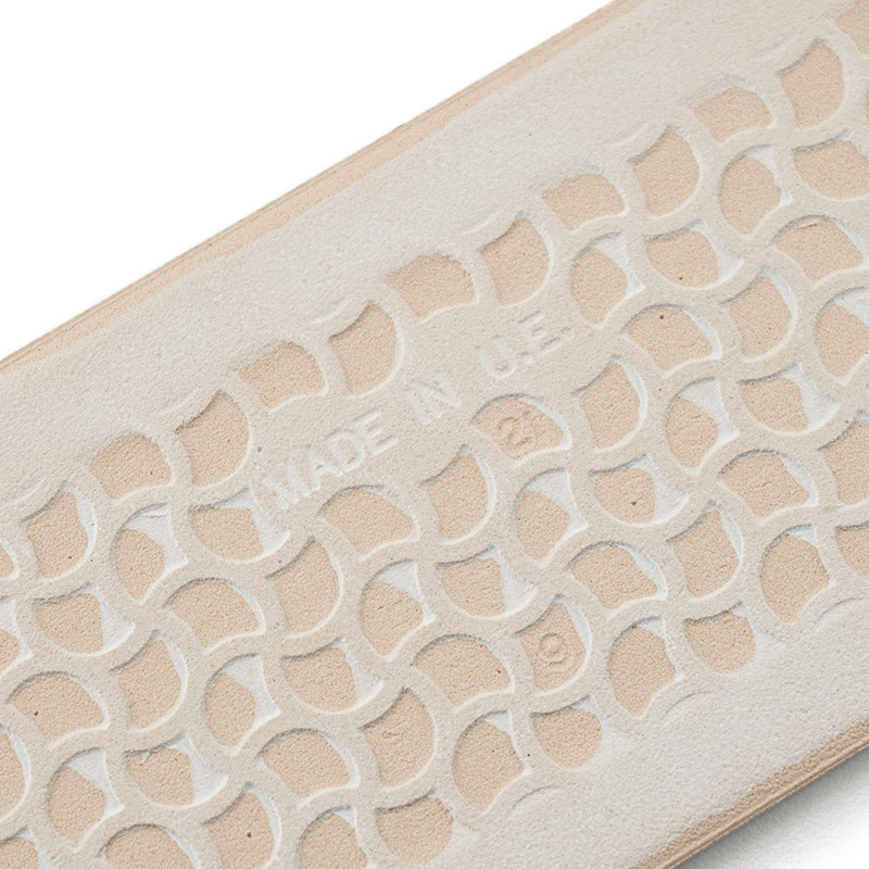 A beige rubber sole features a raised, interlocking geometric pattern with the text `MADE IN U.S.A.` embossed at the center.