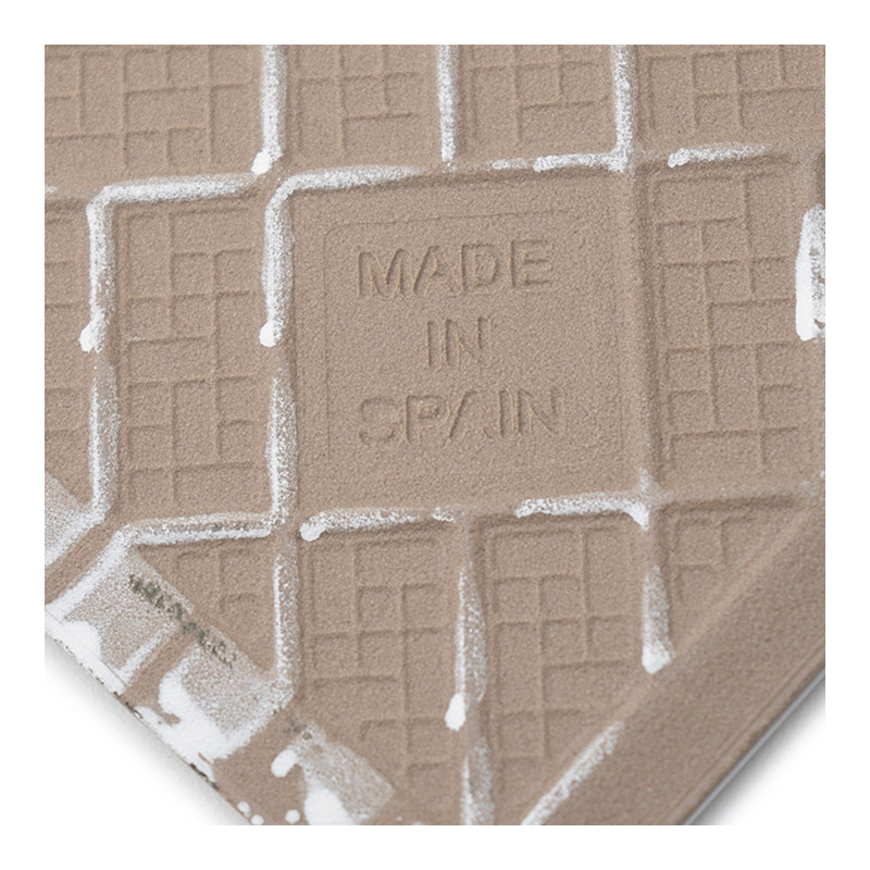 A textured tile features embossed grid patterns and the text `MADE IN SPAIN` at the center, surrounded by white edges.