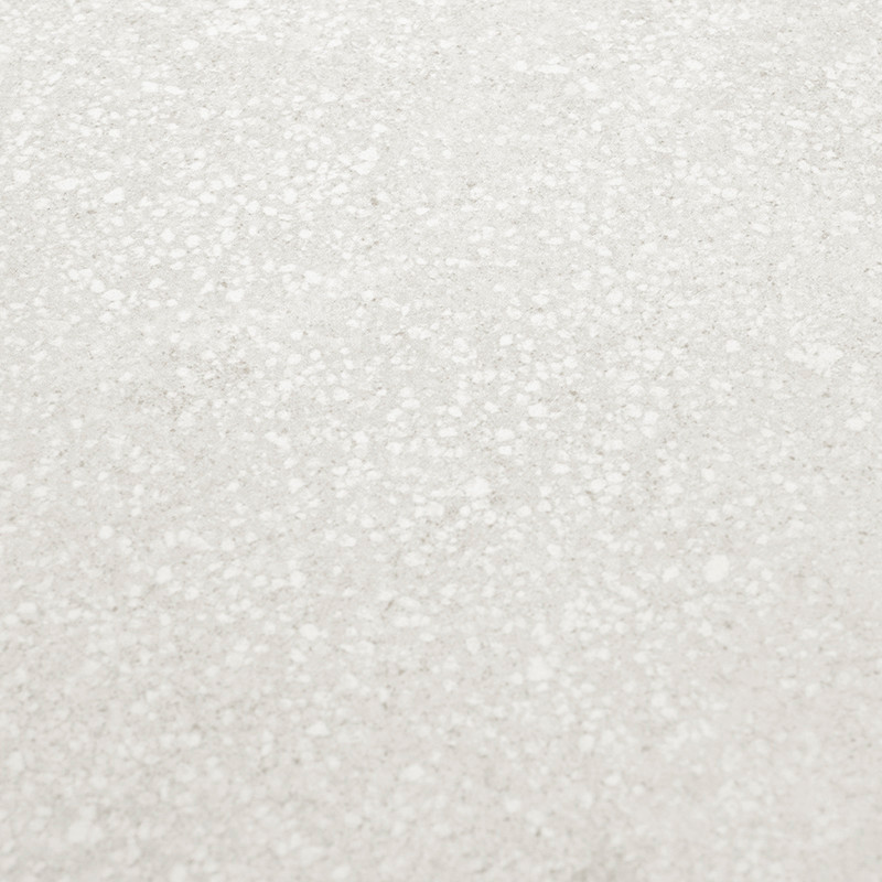 Les carreaux de terrazzo gris présentent un motif de taches blanches dispersées, créant une apparence texturée subtile, générale