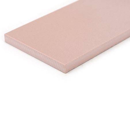 A rectangular, pink ceramic tile rests on a white background, featuring a smooth surface and slightly beveled edges. A rectangular, pink ceramic tile rests on a white background, featuring a smooth surface and slightly beveled edges.