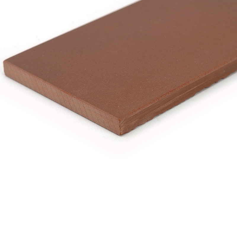 A rectangular, smooth, brown tile lies flat, showcasing its clean edges and matte finish against a plain white background.