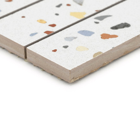 Tile displaying colorful, irregular fragments scattered across a white surface. positioned side-by-side, highlighting textured e Tile displaying colorful, irregular fragments scattered across a white surface. positioned side-by-side, highlighting textured e