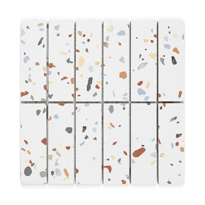 Ceramic tiles display scattered, multicolored terrazzo patterns on a white background, arranged in neat vertical rows for decora