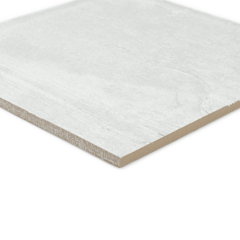 A rectangular, light gray tile rests on a white background. The tiles surface appears smooth with subtle texture, and its edges 