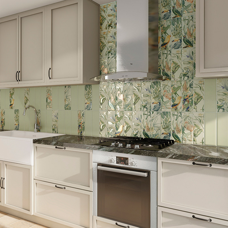 The kitchen features a floral-patterned tile backsplash with green and bird motifs. Below, a white farmhouse sink and black oven