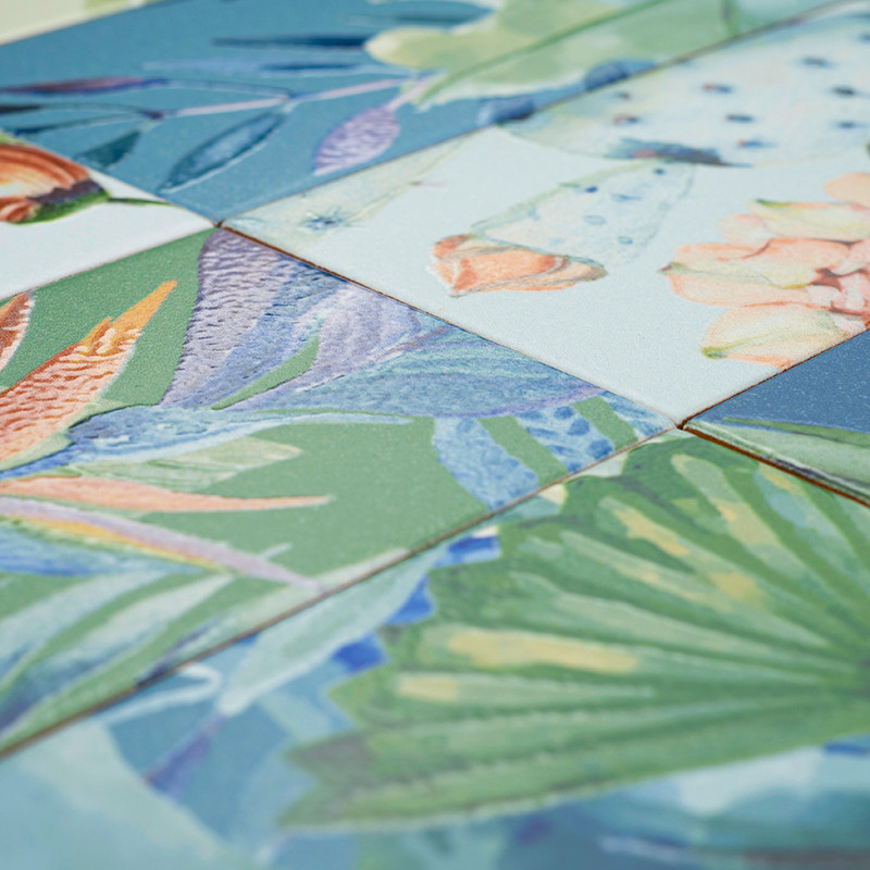 Colorful ceramic tiles display tropical floral designs, angled together. Vibrant leaves and petals create a lush, artistic compo