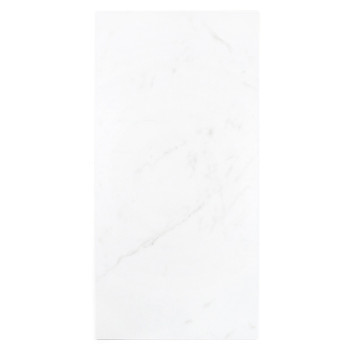 Rectangular white tile features subtle gray veining, resting flat in a simple, minimalist design setting.