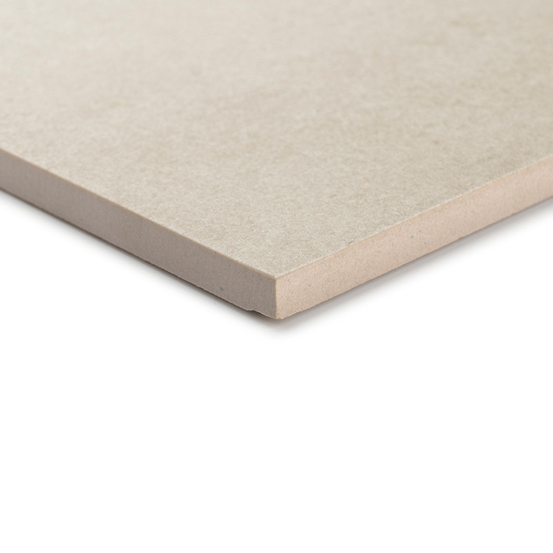 A beige ceramic tile rests flat, showcasing its smooth surface and clean, defined edges, suggestive of durable flooring in minim