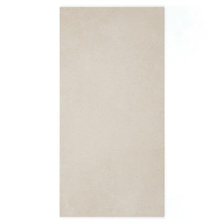 Un carreau rectangulaire beige repose à plat, présentant une surface lisse et uniforme. Il est placé sur un fond blanc uni.