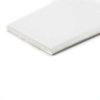 A long, narrow white skirting sits on a white background, emphasizing its simplicity and clean design.