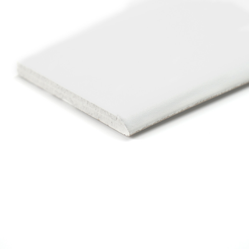 A long, narrow white skirting sits on a white background, emphasizing its simplicity and clean design.