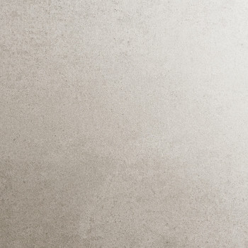 Un carreau beige au fini mat avec une texture mouchetée subtile, ressemblant à de la pierre naturelle, repose à plat et sans per