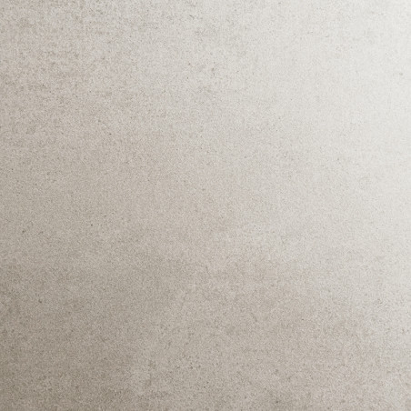 Un carreau beige au fini mat avec une texture mouchetée subtile, ressemblant à de la pierre naturelle, repose à plat et sans per