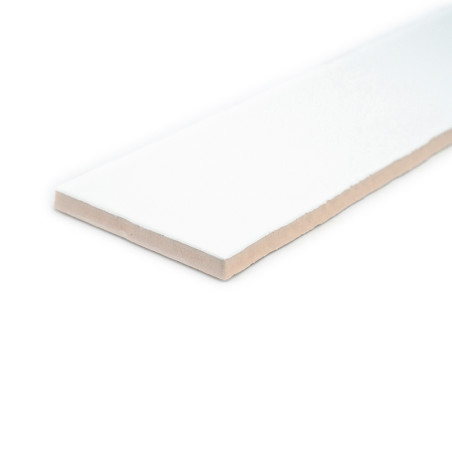 A rectangular, white ceramic tile lies flat on a white background, displaying a smooth surface and a slightly beige edge. A rectangular, white ceramic tile lies flat on a white background, displaying a smooth surface and a slightly beige edge.