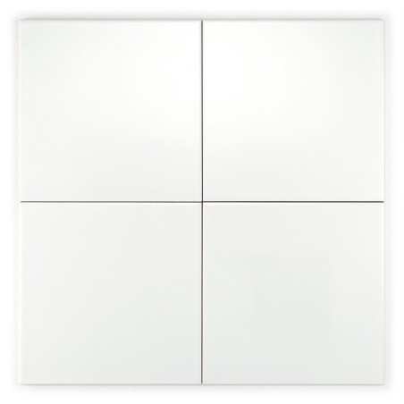 Four plain, white tiles arranged in a two-by-two grid, forming a seamless square pattern, creating a minimalist appearance.