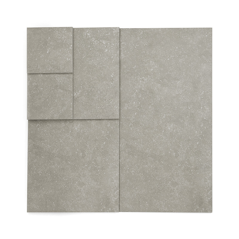 El juego de azulejos consta de cuatro azulejos grises rectangulares de diferentes tamaños, dispuestos sobre un fondo blanco.