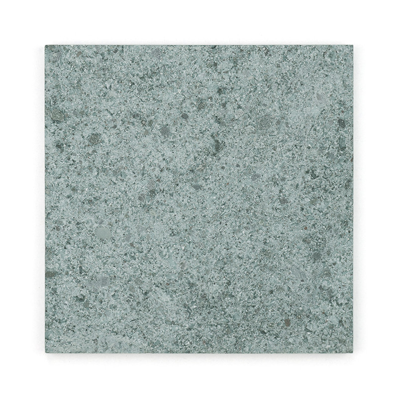 Nove ladrilhos quadrados de pedra verde alinhados em uma grade 3x3, exibindo variações sutis de textura e tonalidade.