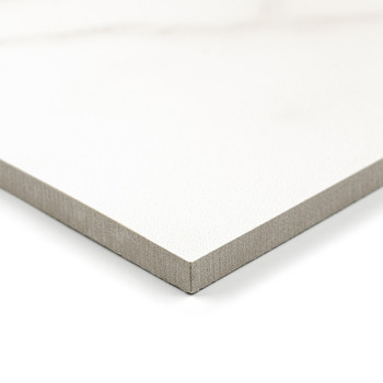 A white, textured tile displays a smooth, glossy surface. it is situated against a plain, light background, emphasizing its clea