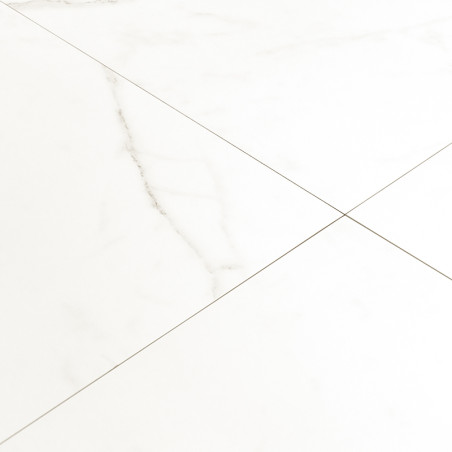 White marble tile features faint gray veins, forming a classic grid pattern. it rests on a flat, smooth surface in a minimalist 