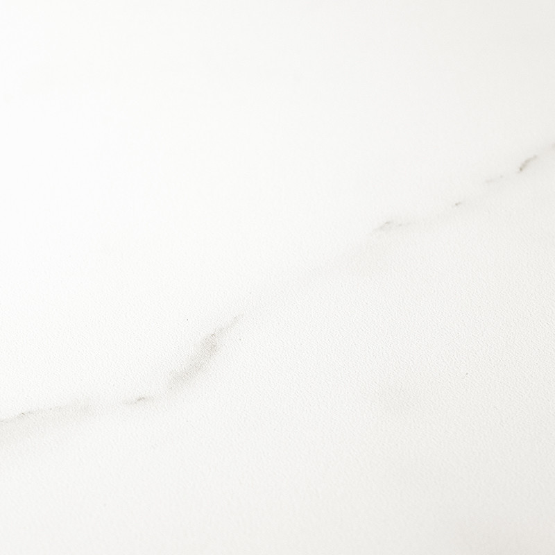 A smooth, white tile features subtle gray marbling, creating a calm, minimalist appearance suitable for modern interior spaces.