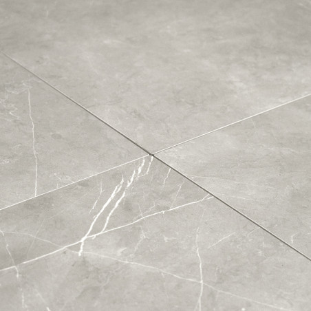Gray ceramic tiles intersect, showcasing subtle white veining. They are arranged neatly on a flat surface, evoking a polished, m Gray ceramic tiles intersect, showcasing subtle white veining. They are arranged neatly on a flat surface, evoking a polished, m