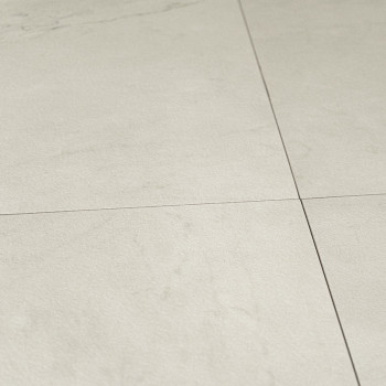 Les carreaux de couleur crème forment un motif de grille à la texture subtile, posés sur une surface de sol lisse, créant un loo