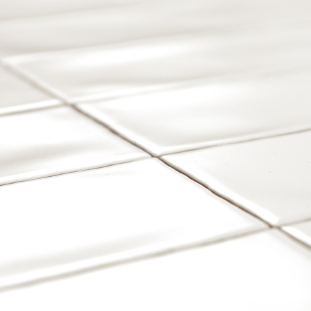 White rectangular tiles are laid out in a grid pattern, casting soft shadows due to light reflection, creating a clean and minim White rectangular tiles are laid out in a grid pattern, casting soft shadows due to light reflection, creating a clean and minim