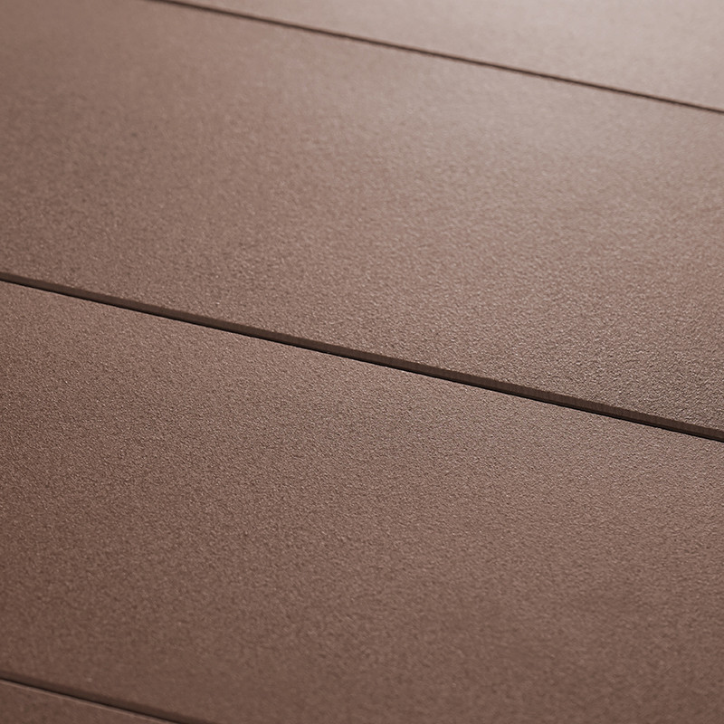 Brown ceramic tiles form a flat surface, aligned with thin, dark grout lines running parallel, creating a uniform, textured floo