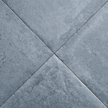 Vier donkergrijze tegels vormen een X-patroon met subtiele marmering, waardoor een gestructureerd oppervlak ontstaat in een neut
