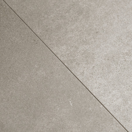 Les carreaux de céramique sont adjacents selon un motif homogène, présentant une finition lisse gris clair avec des textures sub Les carreaux de céramique sont adjacents selon un motif homogène, présentant une finition lisse gris clair avec des textures sub