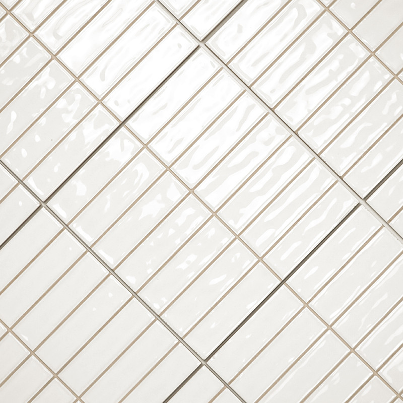 Rectangular white ceramic tiles are diagonally arranged, forming a grid pattern. The glossy surface alternates with visible grou
