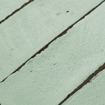 Groene terracottategel met een gestructureerd oppervlak. lijnen creëren een verdeeld patroon, wat buiten- of architectonisch geb
