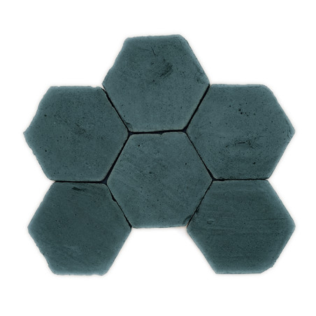Hexagonal terracotta tiles arranged in flower-like pattern, lying flat, set against a plain white background.