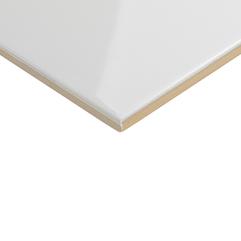 A smooth, glossy white tile with beveled edges, resting on a neutral surface, highlighting its sleek and modern design.