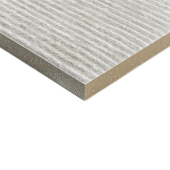 A rectangular, textured tile has a striped surface pattern, resting flat against a plain white background, emphasizing its layer