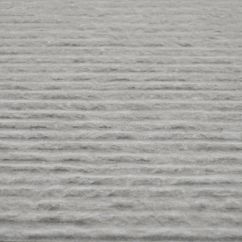 Grey tile surface displays uniform horizontal grooves, creating a textured pattern across its entirety, suggesting a modern or i