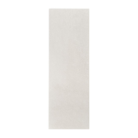 Un azulejo liso y rectangular descansa verticalmente sobre un fondo blanco liso, exhibiendo un sutil color blanquecino con un ac