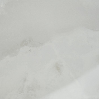A textura do mármore aparece com suaves redemoinhos cinza e branco, criando um padrão turvo e natural, evocando uma sensação de 