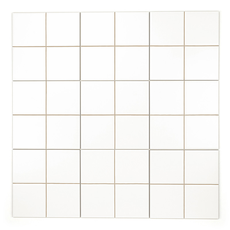 A white ceramic tile divided into four equal squares by thin beige grout lines, creating a simple and minimalist design.