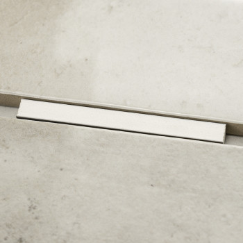 Eine rechteckige, beige Fliese liegt aneinandergereiht und bildet so eine nahtlose Verbindung. Die Fliesen haben eine glatte, st