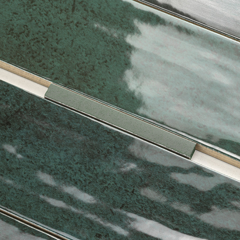Green and teal ceramic tile with a glossy surface, featuring elongated rectangular sections and subtle texture variations, set i